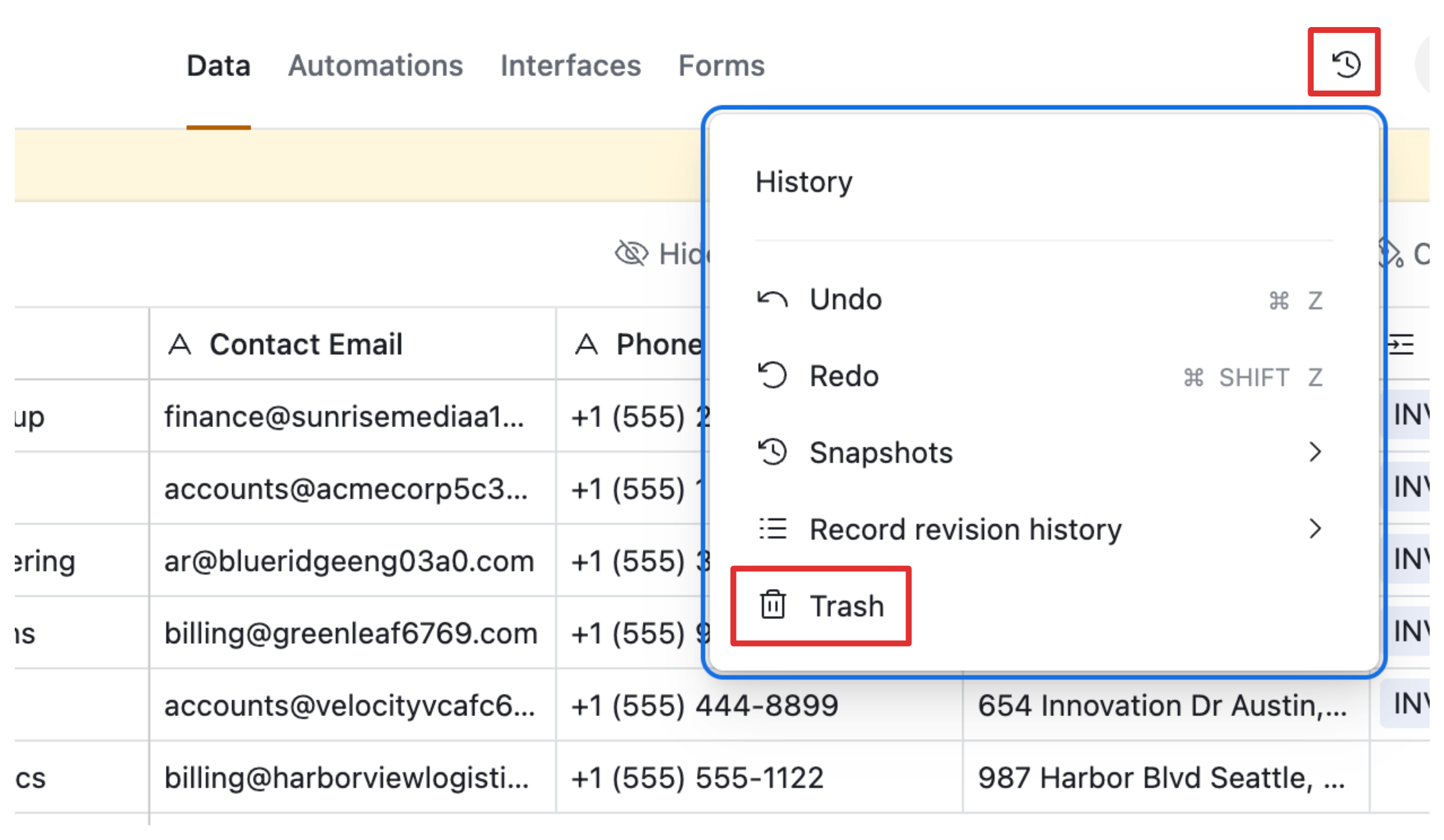 The clock icon in Airtable toolbar opens the revision history and trash panel